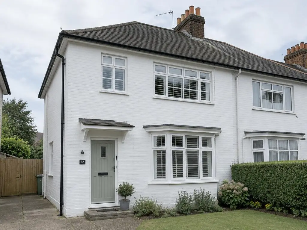 Exterior Painting in Yorkshire Semi-detached house with freshly painted white masonry walls and window frames
